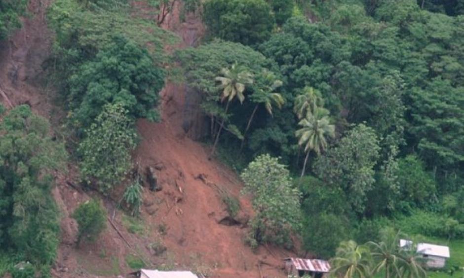 Tukuraki Village seen swamped under dirt after a landslide. Photo: Janet Lotawa