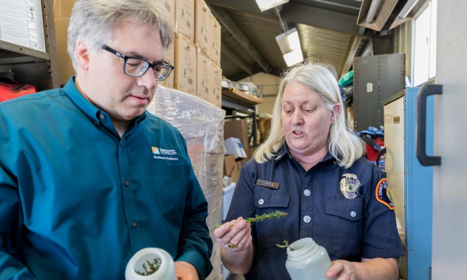 Tom Rolinski inspects sample vegetation at the SCE lab. Credit: Southern California Edison