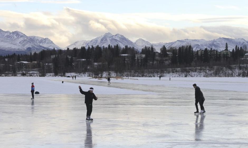In this January 2, 2018 file photo, ice skaters take advantage of unseasonably warm weather to skate outside at Westchester Lagoon in Anchorage, Alaska. Photo: Mark Thiessen, AP