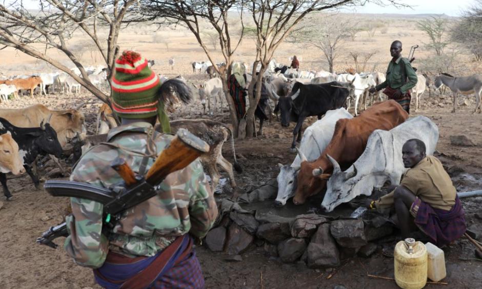Turkana armed tribesmen stand around a borehole in order to protect their cattle from rival Pokot and Samburu tribesmen near Baragoy, Kenya, Feb. 14, 2017. Photo: Reuters