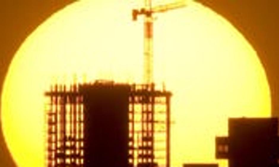 The sun sinks behind the downtown Phoenix skyline. Photo: Rob Schumacher, The Republic