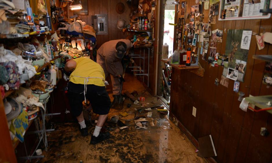 A Coast Guard team help cleanup a house in Baton Rouge in the wake of this summer’s extreme floods. Photo: Coast Guard News/flickr