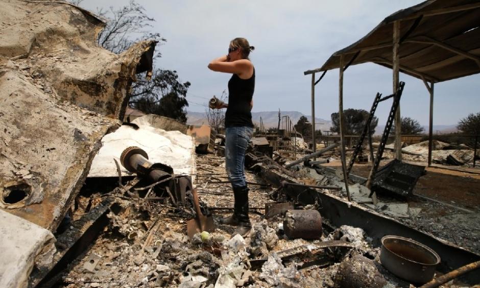Amy Nelson, 30, breaks down as she goes through the remains of her home devastated by the Erskine Fire, Saturday, June 25, 2016, in South Lake, Calif. "I didn't think it was going to be this bad," said Nelson. Photo: Jae C. Hong, AP
