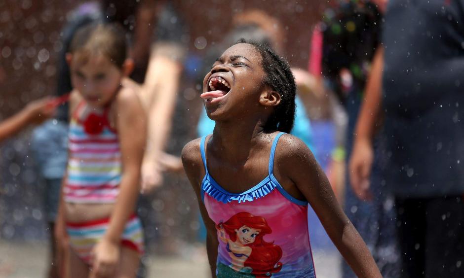 Hundreds of area children enjoyed playing in the water and being sprayed during Big Splash Day at the Joe on July 13. Forecasters say a well-deserved break from the extreme heat and humidity is on the way as we enter August. Photo: Grace Beahm