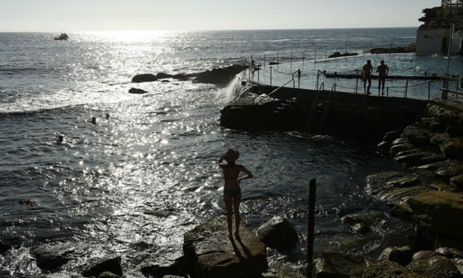 People enjoying the cooler morning conditions at Bronte beach in Sydney’s east on Friday morning. Photograph: Dan Himbrechts/AAP