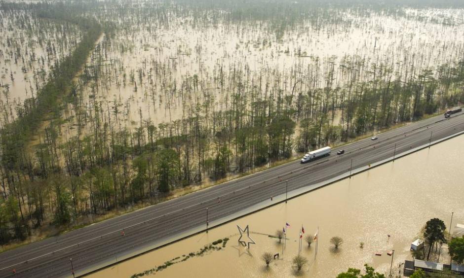 Floodwaters build up around the Texas Travel Information Center, bottom, on Interstate 10 near Orange, Texas. Photo: Brett Coomer, Houston Chronicle/Associated Press