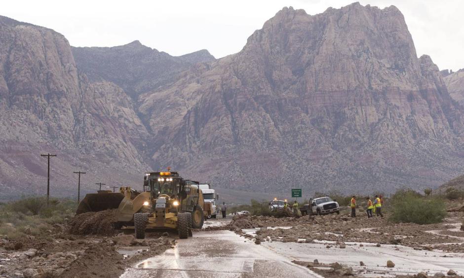 Crews on Highway 159 just south of Bonnie Springs in Red Rock Canyon National Conservation Area near Las Vegas work to reopen the highway, which was closed because of a washout Thursday. Photo: Jason Ogulnik//Las Vegas Review-Journal / AP