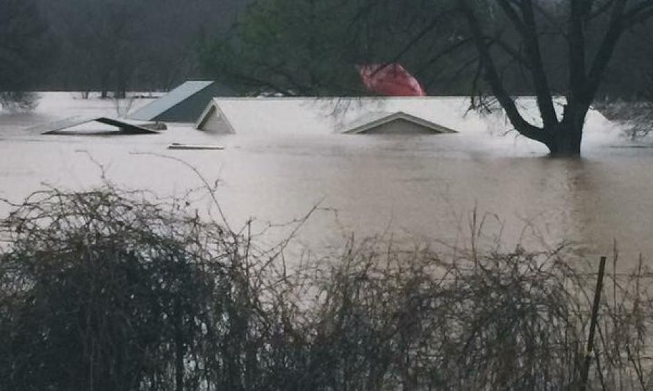 The effects of a deadly storm system that triggered tornadoes and flooding in the Midwest and Southwest could be see in Union, Mo., where homes and businesses are nearly underwater. Photo: Reuters