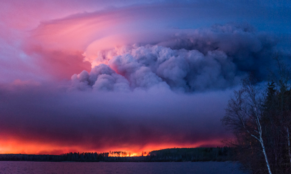 A massive wildfire rages Wednesday evening, May 4, 2016, near Anzac, Alberta, a hamlet 48 km southwest of Fort McMurray. The community and surrounding area was evacuated. A state of emergency exists in the Regional Municipality of Wood Buffalo as a result of wildfires. Photo: Chris Schwarz, Government of Alberta via Creative