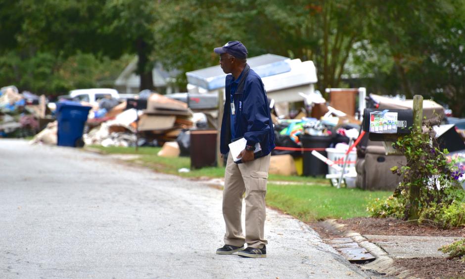 FEMA Disaster Survivor Assistance team member James Mason walks through a Lexington, S.C., neighborhood hit hard by severe flooding in October. Photo: Bill Koplitz, FEMA
