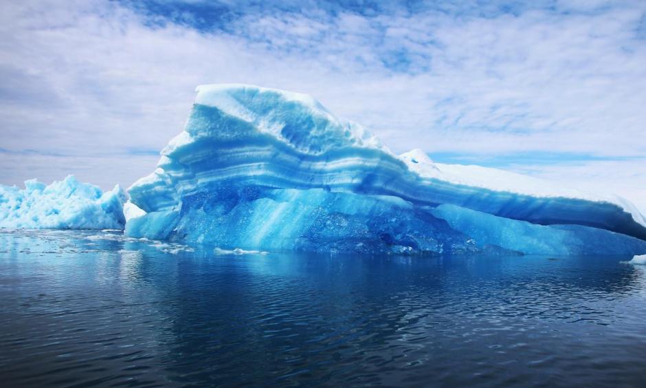 This year is set to be Earth's warmest in millennia, according to new data—with profound implications. Here, calved icebergs are seen floating on the water on July 30, 2013, in Qaqortoq, Greenland. Photo: Joe Raedle, Getty Images