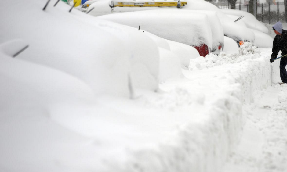 A man shovels to dig out his car in Silver Spring, Maryland, on Feb. 6, 2010, during the "Snowmageddon" snowstorm. This week's blizzard may rival some of the biggest East Coast winter storms in history. Photo: Jewel Samad, AFP, Getty Images