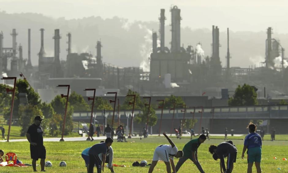 Youth activities go on at Wilmington Waterfront Park, in the shadow of the Phillip 66 Los Angeles refinery. The community of Wilmington, near the Port of Los Angeles, has one of the highest ozone levels in the United States. (Carolyn Cole / Los Angeles Times/Los Angeles Times)