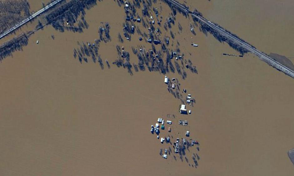 Dozens of houses are seen here underwater in West Alton, Missouri, a town of 522 people. The community lies at the confluence of the Missouri and Mississippi Rivers. (NOAA)