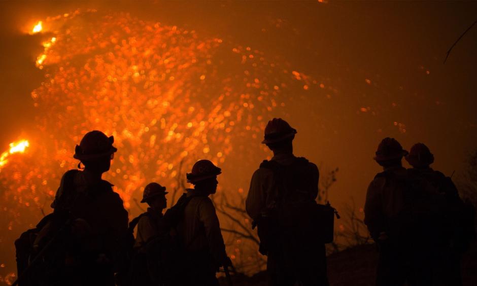 Firefighters battle an expanding wildfire Friday night near Santa Barbara, California. Photo: AFP / Getty