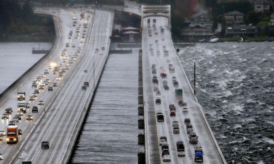 Eastbound traffic lanes, right, on Interstate 90 are dampened by wind-driven waves from the south as the floating bridge calms Lake Washington to the north, left, Tuesday, Nov. 17, 2015, in Seattle. Image credit: AP Photo/Elaine Thompson.