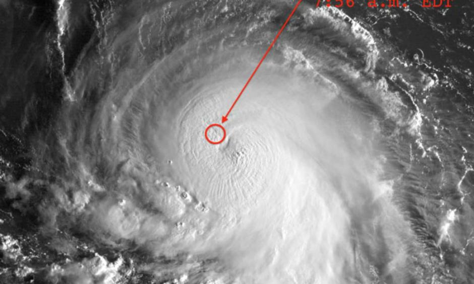 Figure 3. Hurricane Joaquin as seen by the GOES-East satellite at 7:45 am EDT October 1, 2015. At the time, Joaquin was an intensifying Category 2 storm with 110 mph winds. The last position of the cargo ship El Faro, in the northwestern eyewall of Joaquin, is shown. Image credit: United States Navy and NOAA.