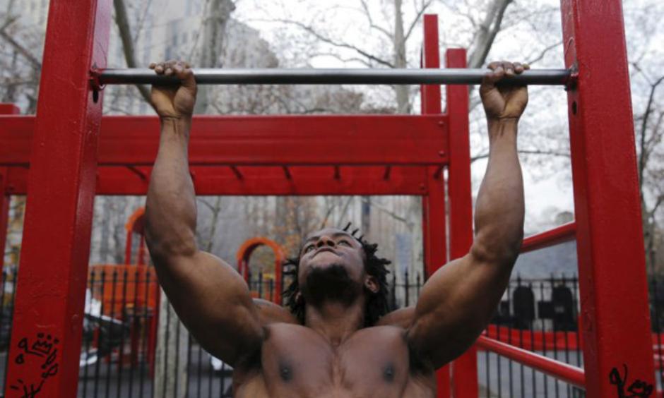 A man exercises in Manhattan during an unseasonably warm December Sunday. Lucas Jackson / Reuters