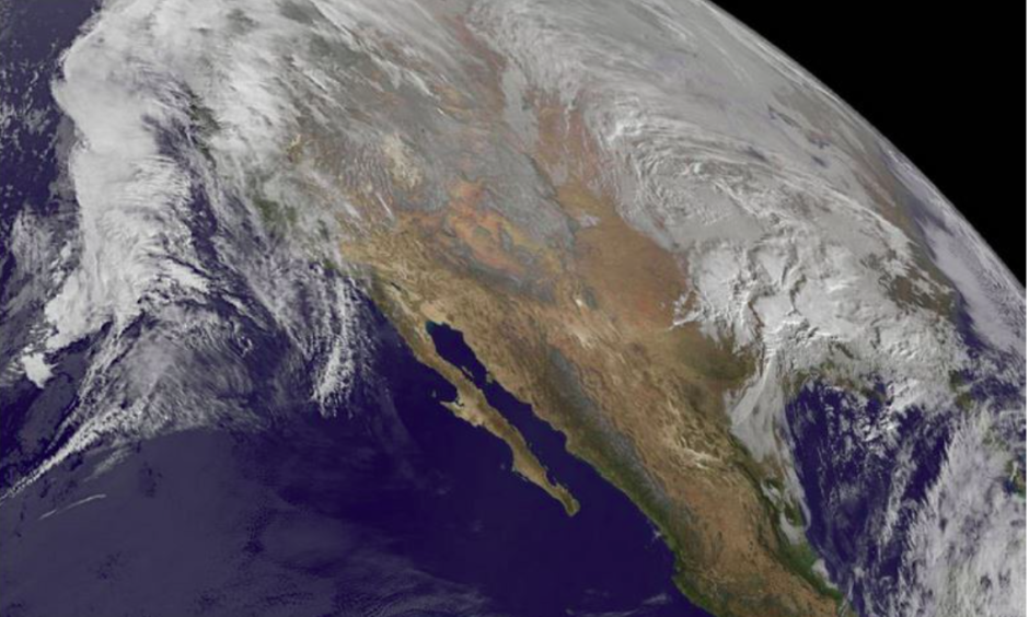Winter storm Jonas gathers itself on Thursday. Near-record sea surface temperatures in the mid-Atlantic – which scientists suggest are driven in part by global warming – are helping to fuel this storm. Phot: NASA/NOAA GOES Project