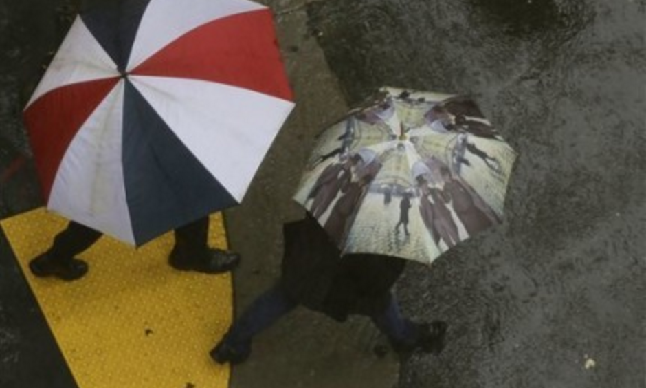Successive storms bringing rain and snow this weekend could considerably ease California's ongoing fears of drought, according to the National Weather Service. Here, San Francisco pedestrians rely on umbrellas to stay dry. Photo: Jeff Chiu, AP