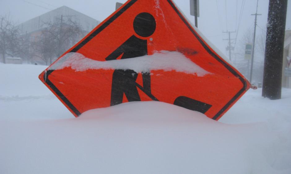 Sign partially covered by snow Jan. 23 in DC during the storm named Snowzilla. Photo: Rebekha Halseth