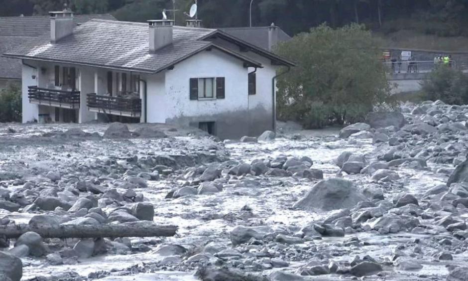 Rocks and debris cascaded down the mountain to the edges of Bondo village. Photo: BBC via Reuters