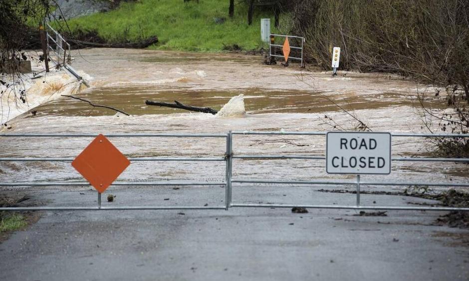 Water floods Mormon Bar Crossing in Mariposa, Calif., on Thursday, March 22, 2018. Photo: Andrew Kuhn