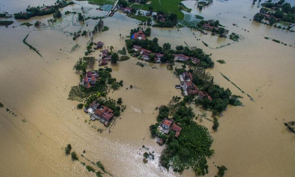 Village houses and field partially submerged by floodwaters in Gaoyang Town, Shayang County, central China's Hubei Province. Photo: Xinhua News Agency