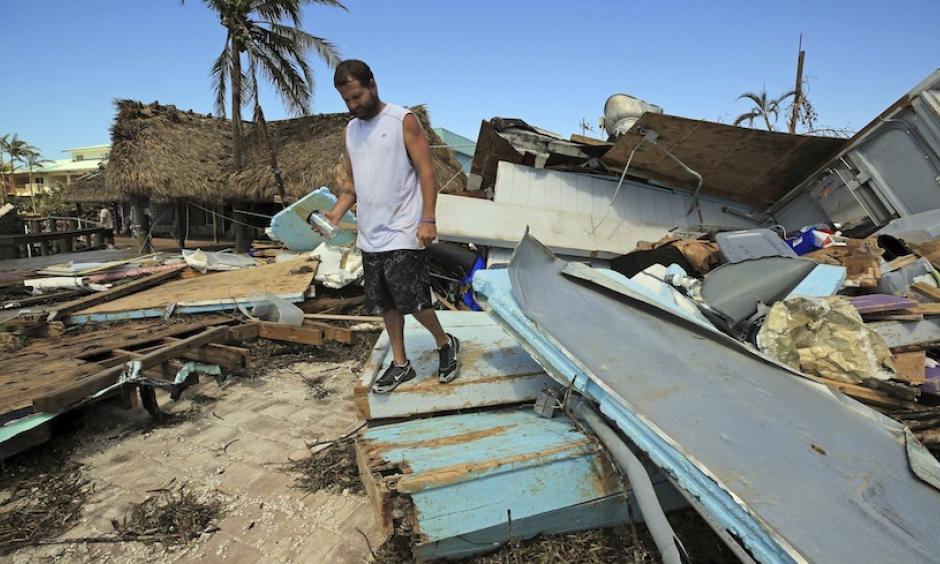 Eric Ward, the bartender at Key Largo's Snappers, inspects the damage from Hurricane Irma at the popular restaurant on Tuesday, Sept. 12, 2017, in Key Largo, Fla. Florida is cleaning up and embarking on rebuilding from Hurricane Irma, one of the most destructive hurricanes in its history. Photo: Al Diaz, Miami Herald via AP
