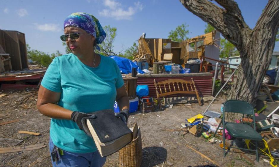 In this Thursday, Sept. 14, 2017, photo, Barbara De Luna holds a bible she recovered from her destroyed home in Bayside, Texas. Bayside took a direct hit from Hurricane Harvey on Aug. 25. Photo: Mark Mulligan, Houston Chronicle via AP