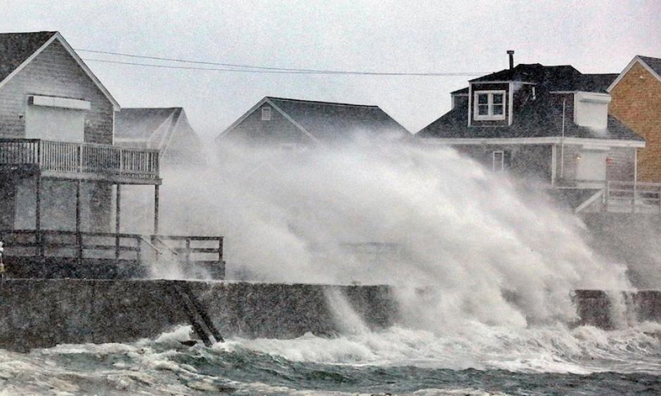 Blizzard conditions slammed snow and spray into the coast of Scituate, Mass., south of Boston, on Thursday, Jan. 4, 2018. Photo: Greg Derr /The Quincy Patriot Ledger via AP