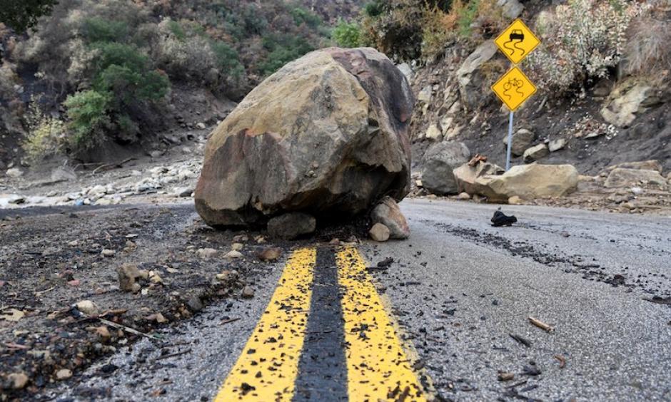 A large boulder sits in the middle of Bella Vista Drive in Montecito, Calif., following heavy rains and mudslides on Tuesday, Jan. 9, 2018. Photo: Michael Owen Baker, AP