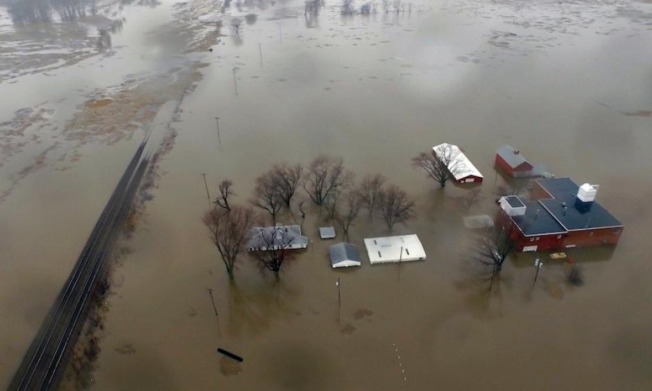 This aerial photo from Tuesday, March 19, 2019, shows flooding along the Missouri River in Pacific Junction, Iowa. The U.S. Army Corps of Engineers says rivers breached at least a dozen levees in Nebraska, Iowa and Missouri. Hundreds of homes are damaged, and tens of thousands of acres are inundated with water. Photo: DroneBase via AP