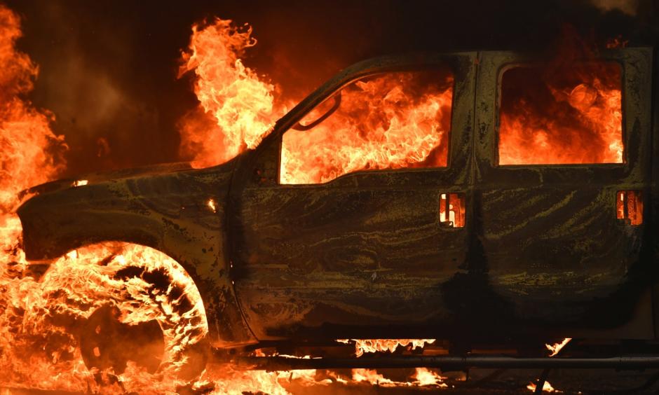 A truck burns on Main Street in the town of Lower Lake, Calif. on Sunday. Photo: Josh Edelson, AP