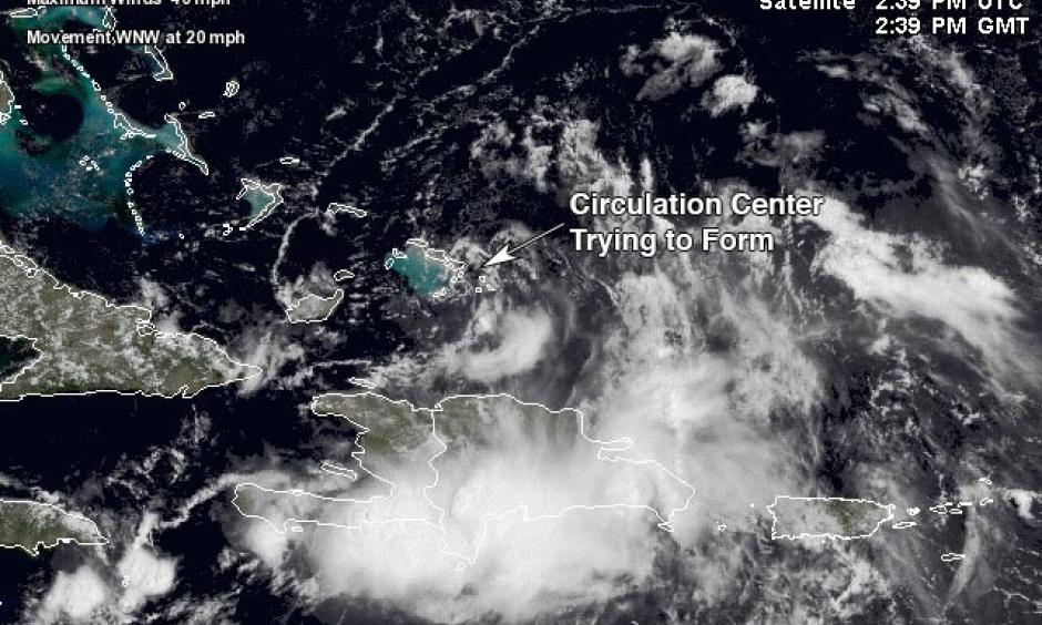 Satellite image of 99L taken at 10:39 am EDT August 25, 2016. A surface circulation center was trying to form over the southeastern Bahamas and Turks and Caicos Islands. Image: NASA, Weather Underground