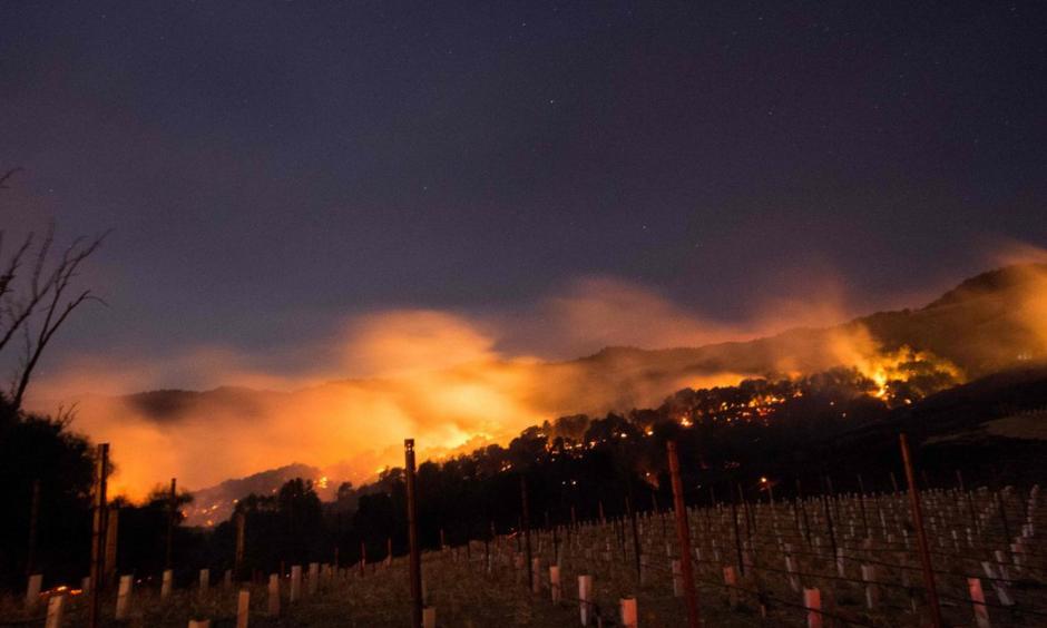 Fire glows on a hillside in Napa. Photo: Josh Edelson, AFP/Getty Images