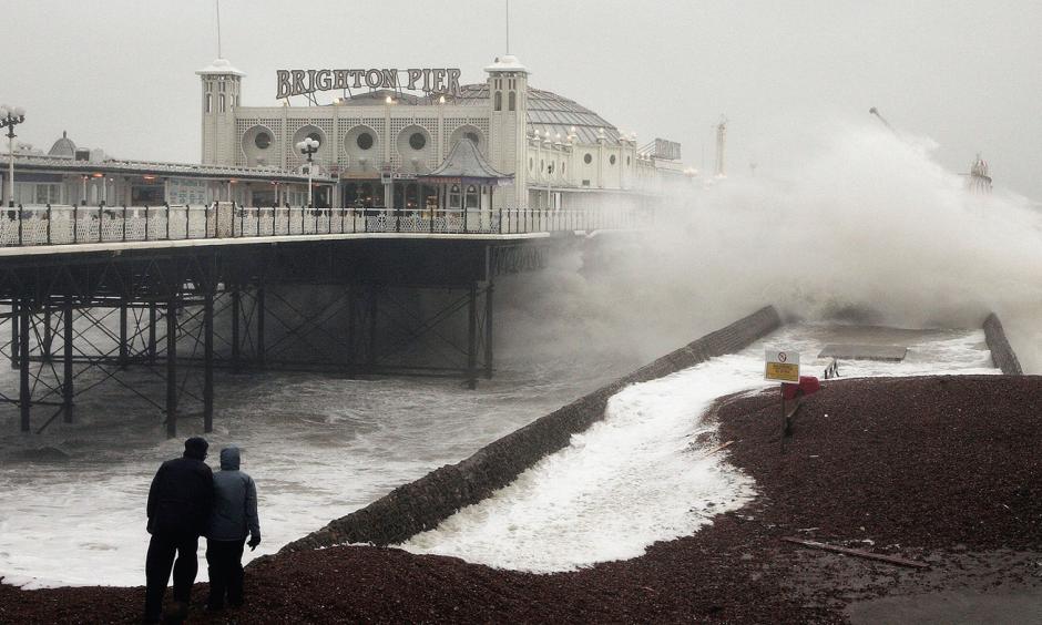 Waves crash onto the beach near Brighton Pier in England, in January 2007. Gale force winds and heavy rain brought disruption to large parts of the country. Severe weather events like this one may be linked to more frequent fluctuations in the polar jet stream, according to a new study. Photo: Peter Macdiarmid, Getty Images