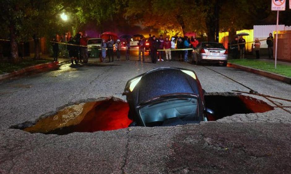 Sinkhole swallows two cars in Studio City. Photo: Los Angeles Times