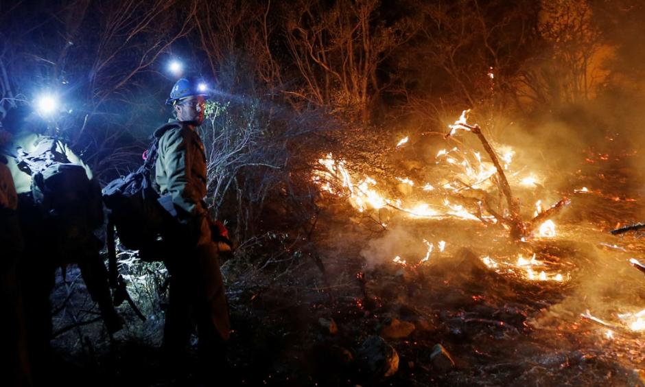 Firefighters build a fire line during the Blue Cut Fire in California's San Bernardino County in August. Photo: Patrick T. Fallon, Zuma