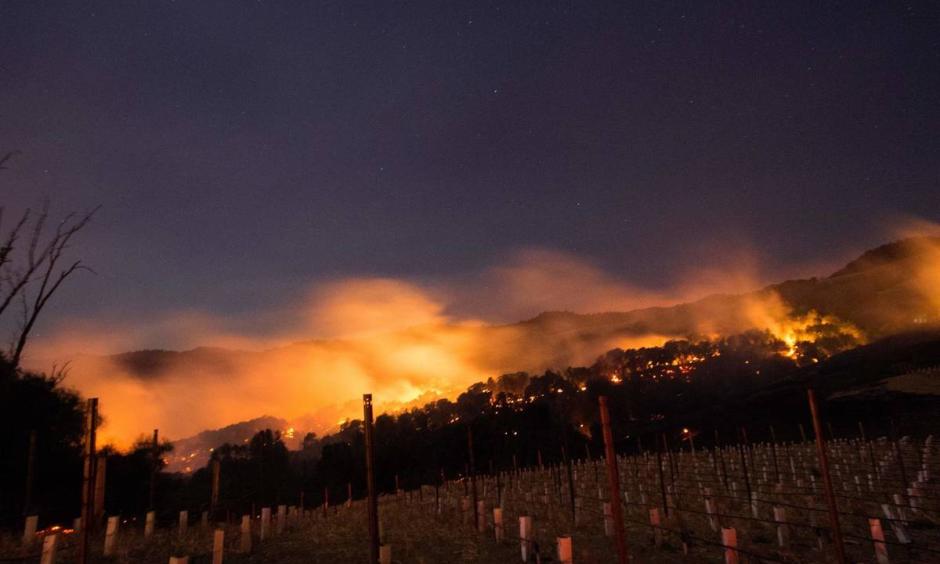 Fires spread by the Diablo winds and fueled by dry grass and brush spread through California's Napa and Sonoma regions in early October 2017. Scientists say climate change is loading the dice for wildfires. Photo: Josh Edelson, AFP/Getty Images