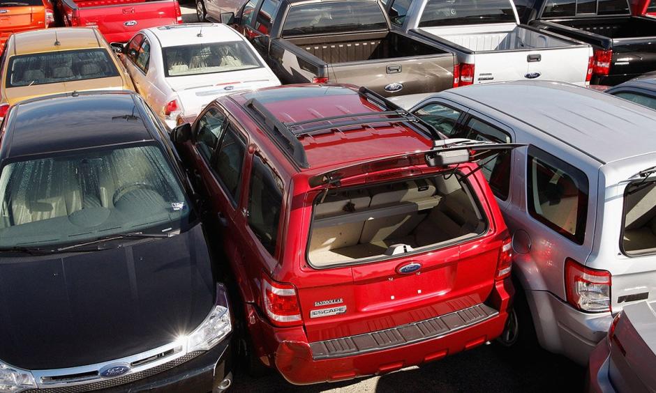 Cars sitting in the rear of a used car lot were left pushed together following Hurricane Ike September 16, 2008, in Galveston, Texas. Today, cars from Hurricane Harvey are being sold in the marketplace. Photo: Scott Olson/Getty Images
