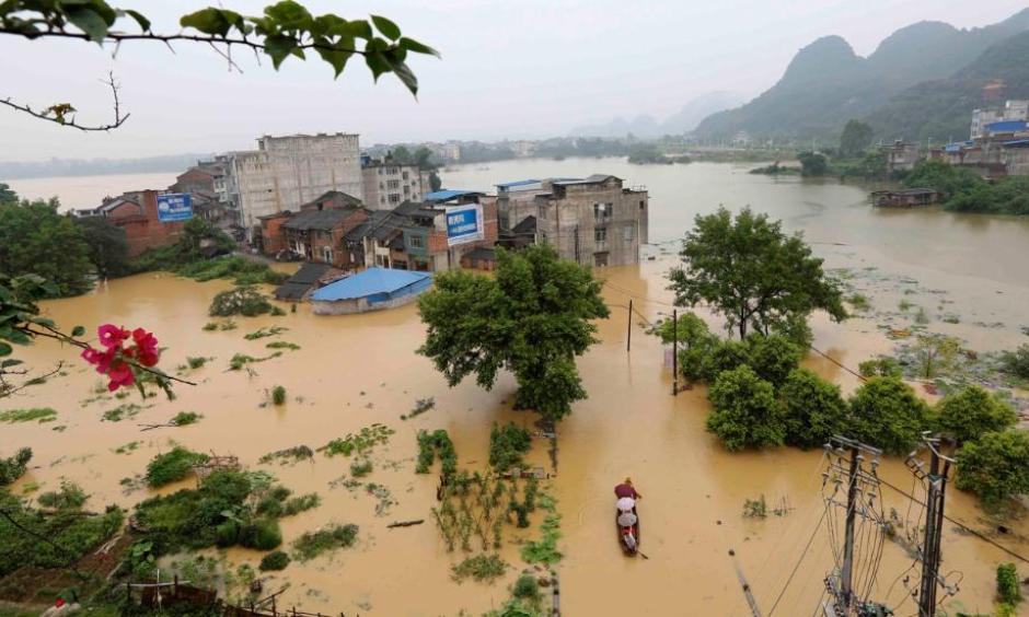 Aerial view of the flooded houses at Rongshui Miao Autonomous County on July 3, 2016 in Liuzhou, Guangxi Province of China. Photo: Long Tao/VCG via Getty Images