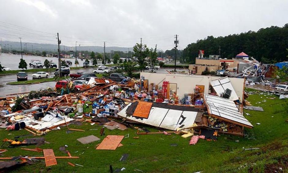 At approximately 1 pm CDT Thursday, Cindy spawned an EF2 tornado that left damage in areas southwest of Birmingham, Alabama, and injured at least four people. According to weather.com, Severe damage was reported to a Kentucky Fried Chicken restaurant in Fairfield, a town of 10,000 about 10 miles southwest of Birmingham. WTVM-TV said an Express Oil Change shop and an ABC liquor store were destroyed, and three people were hospitalized with minor injuries. Photo: Butch Dill, AP