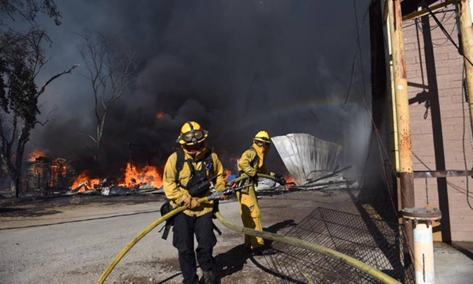 Firefighters battle Clayton Fire in the town of Lower Lake. Photo: Sacramento Bee