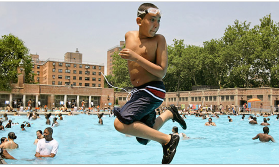 A youngster takes a backward plunge into the Thomas Jefferson pool in East Harlem in New York during a citywide heat wave in July. Photo: AP