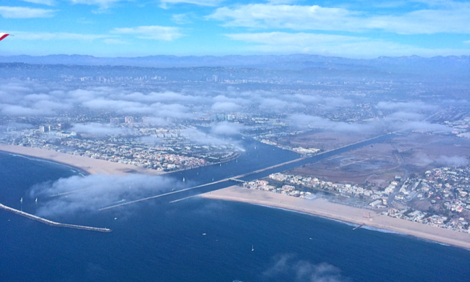 Low-level clouds over Los Angeles (seen here in early afternoon) and other urban areas of coastal southern California are becoming rarer, leading to increased fire risk. Photo: Park Williams