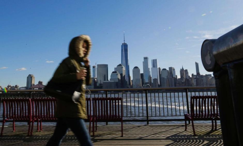 A commuter from New Jersey to New York, bundled up against the wind and the cold temperatures on November 10, 2017 in Exchange Place, Jersey City, N.J. The National Weather Service issued a freeze warning for the area. Photo: Getty Images