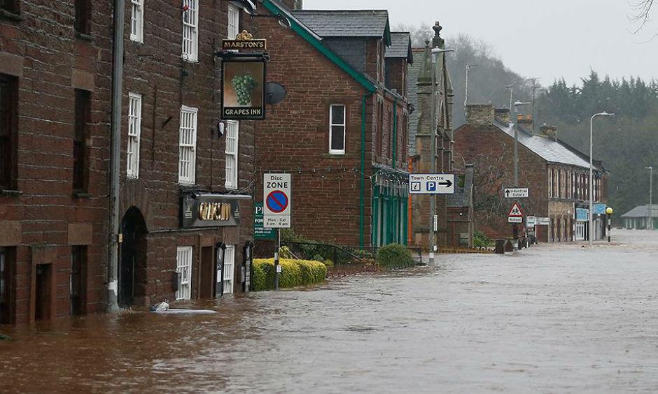 Flooded roads in the centre of Appleby, north west England, as Storm Desmond hits the United Kingdom, Saturday Dec. 5, 2015. Roads have been closed throughout the North and Scotland as Storm Desmond caused road chaos, landslides and flooding. Photo: Owen Humphreys/AP