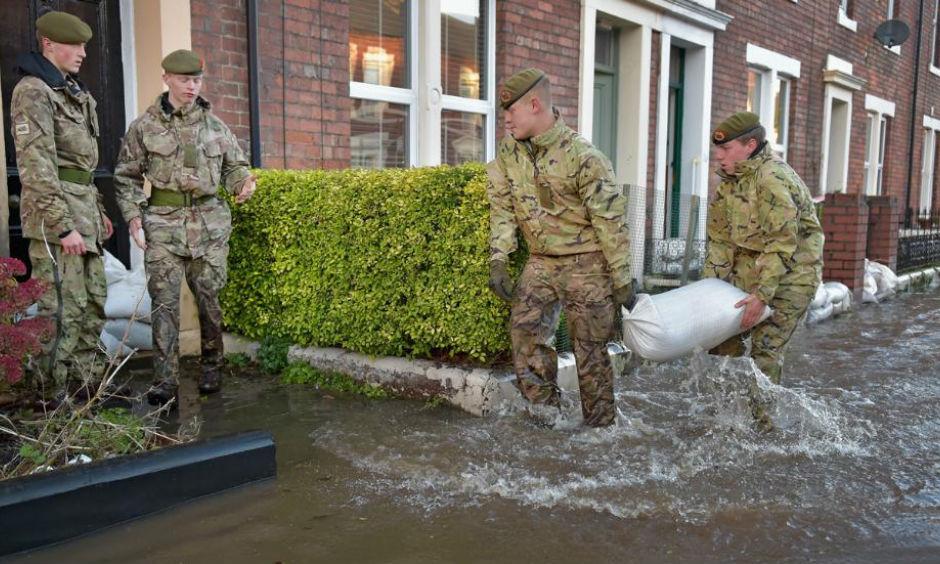 Members of the Army help with the rescue effort after Storm Desmond caused flooding on December 6, 2015 in Carlisle, England. Storm Desmond has brought severe disruption to areas of northern England as dozens of flood warnings remain in place. Photo: Jeff J Mitchell/Getty Images