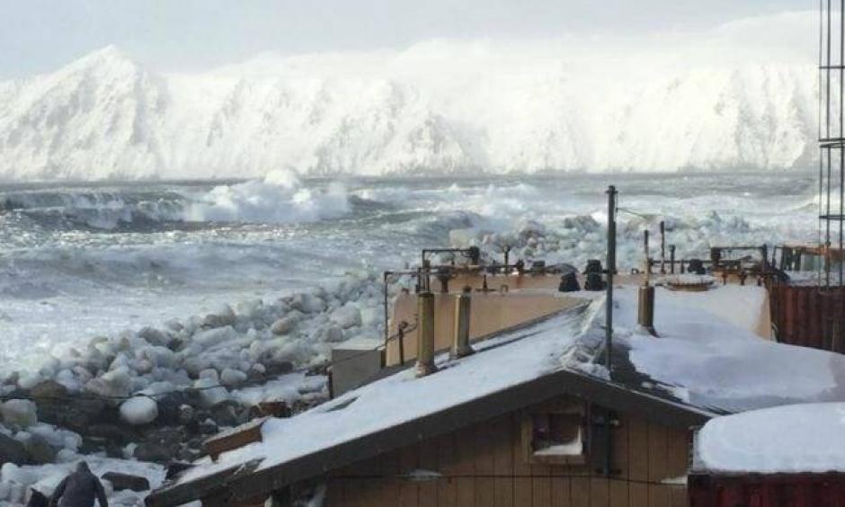 Waves batter Little Diomede Island, where the coastal community is normally protected by ice through the winter. This year was different. Photo: Frances Ozenna